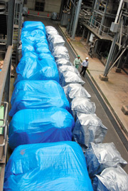 Bags of incineration ash are piled up on the passageway of a sewage treatment facility in Kawasaki. (Mikio Kano)